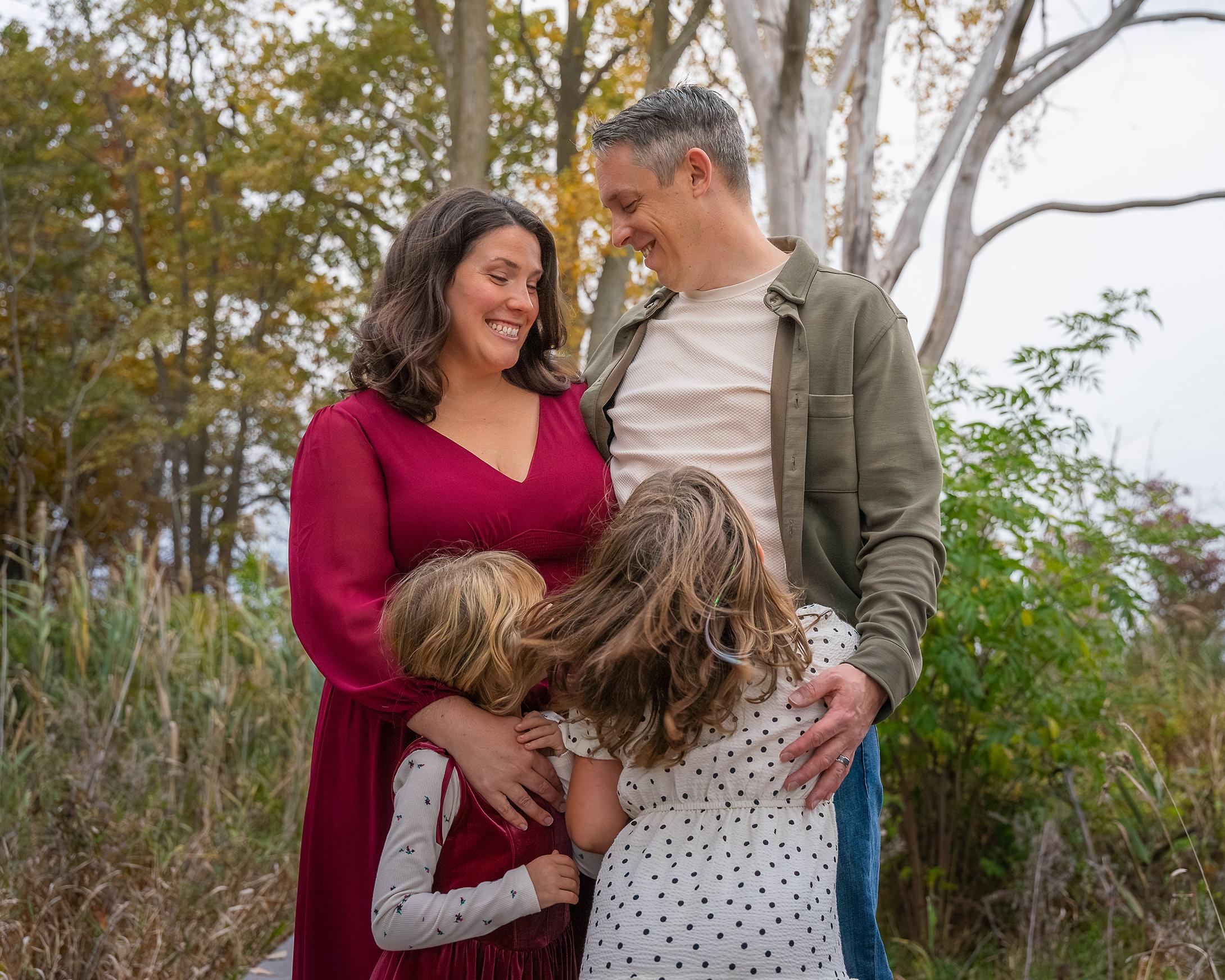 Mom and dad enjoying their silly kids